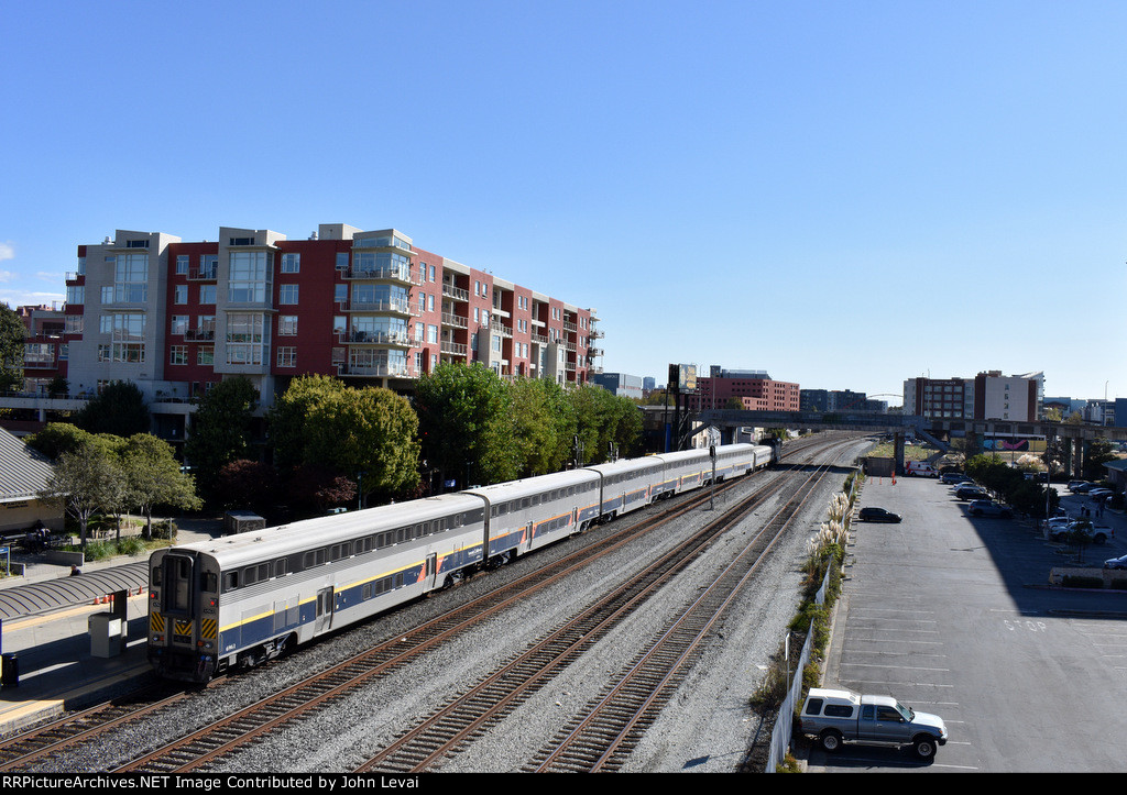 The San Joaquin Train heads away from Emeryville Station toward its next and last stop of Oakland Jack London Square